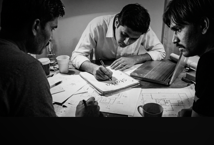 Team collaborating in an office during the founding of the company