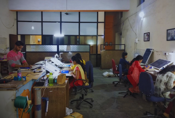 Manager reviewing production setup at the first manufacturing unit